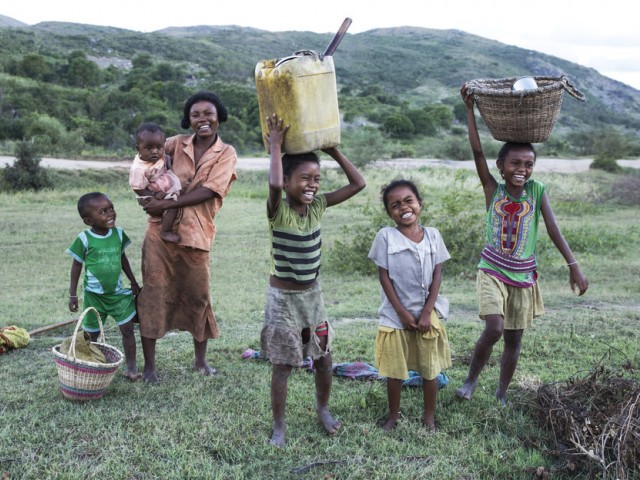 Children and their family in a rural field