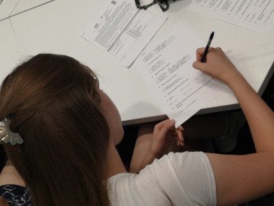 Image of woman writing during an Ivanjica English language course 