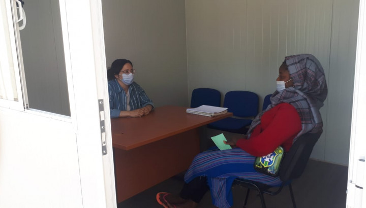 Image of a woman is having a consultation session with a therapist.
